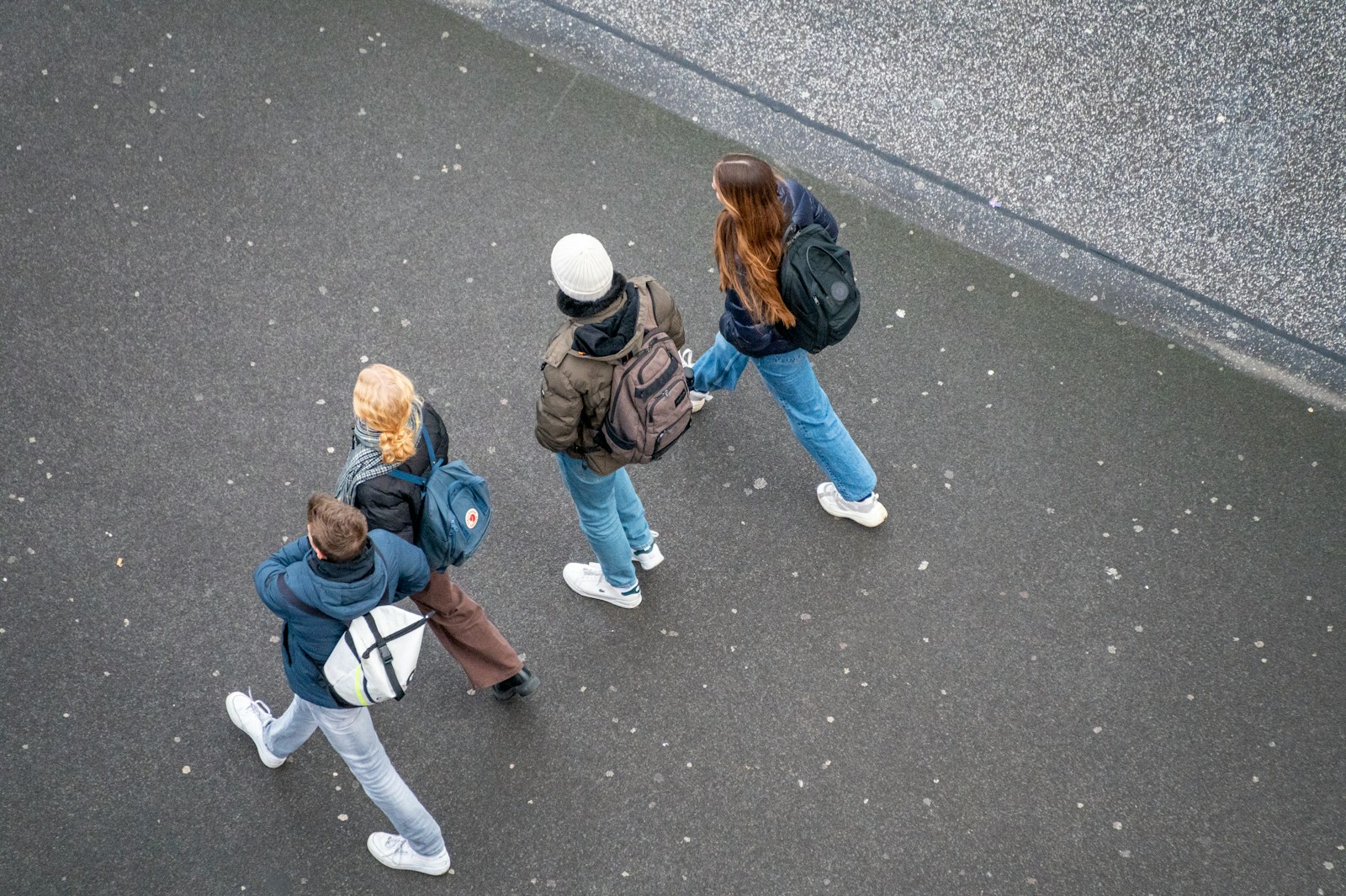 a group of people walking down a street